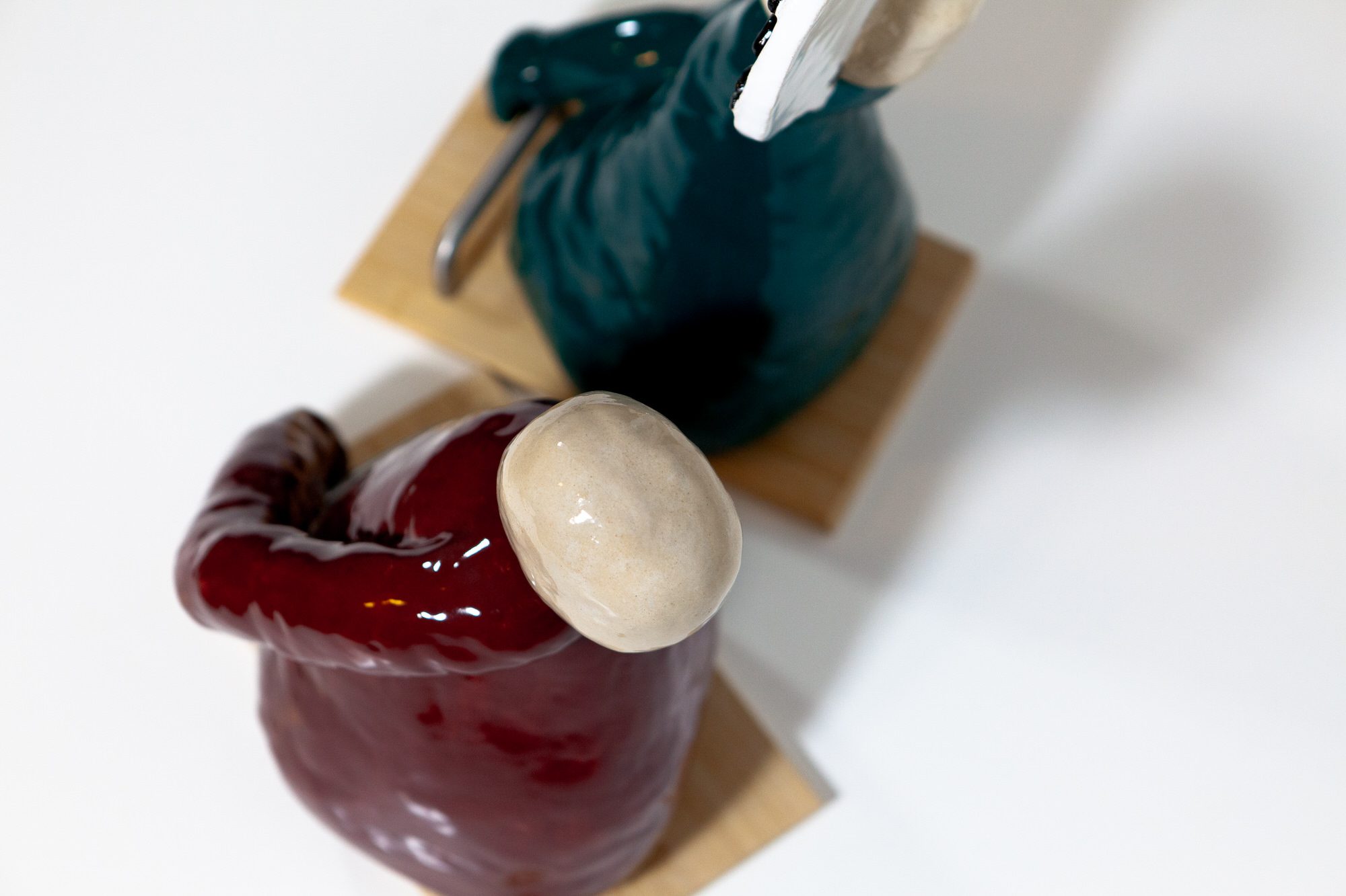 Sylvia Schwenk, the see-saw is no more from absurdity, 2 parts ceramic sculpture plus timber and metal, 35cm x 50cm x 23cm